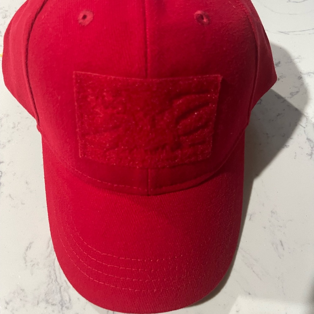 Solid red cap with velcro on front and rear for patches and name tags